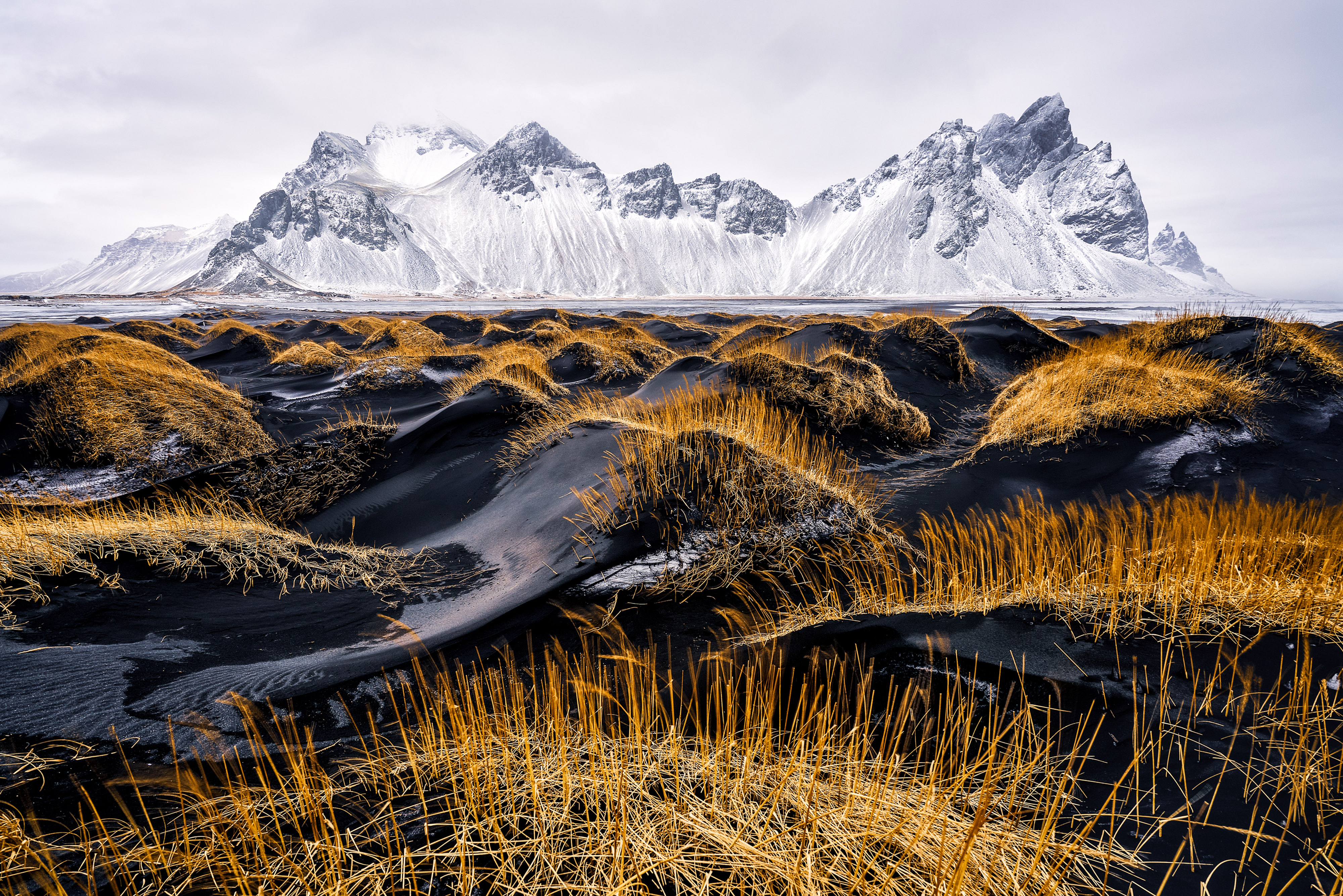 Winter in Stokksnes on the beach with black sand and the majestic mountain, Vestrahorn.